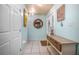 Inviting entryway with tile floors, a stylish bench, and warm decor that creates a welcoming ambiance at 1258 Russell Dr, Ocoee, FL 34761
