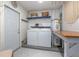 Laundry room with a washer and dryer, utility sink, and access to the back yard at 1258 Russell Dr, Ocoee, FL 34761
