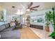 Bright living room featuring a comfortable sectional, large windows, and view of the pool at 1258 Russell Dr, Ocoee, FL 34761