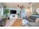 Cozy living room featuring a large sectional, large flat screen tv, and neutral colors for a relaxing atmosphere at 1258 Russell Dr, Ocoee, FL 34761