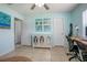 Home office with tiled floors, wall art, and a desk with chairs at 1258 Russell Dr, Ocoee, FL 34761