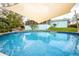 Inviting backyard pool for refreshing swims and shaded seating, perfect for outdoor gatherings at 1258 Russell Dr, Ocoee, FL 34761