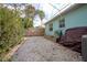 Side yard featuring rock bed and a gate at 1258 Russell Dr, Ocoee, FL 34761