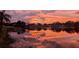Beautiful sunset view over the lake behind the home at 1258 Russell Dr, Ocoee, FL 34761