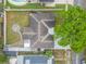 An aerial view of the home reveals the backyard landscaping, gray roof and perimeter fencing at 1259 Vanderbilt Dr, Ormond Beach, FL 32174