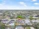 An aerial view shows the surrounding residential neighborhood and manicured lawns at 1259 Vanderbilt Dr, Ormond Beach, FL 32174