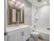 Cozy bathroom with a tub and shower combo, white cabinets, and stylish fixtures at 1259 Vanderbilt Dr, Ormond Beach, FL 32174