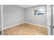 This bedroom features neutral walls, tile flooring, and one double hung window at 1259 Vanderbilt Dr, Ormond Beach, FL 32174