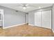 Spacious bedroom featuring tiled floors, a ceiling fan, and a large closet at 1259 Vanderbilt Dr, Ormond Beach, FL 32174
