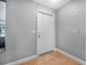 Neutral entryway featuring tile flooring and a simple white entry door at 1259 Vanderbilt Dr, Ormond Beach, FL 32174
