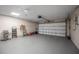 Spacious garage with ample storage and a modern ceiling fan at 1259 Vanderbilt Dr, Ormond Beach, FL 32174
