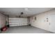 Spacious garage with ample storage and a white garage door at 1259 Vanderbilt Dr, Ormond Beach, FL 32174