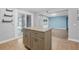 Open kitchen with tiled floors, a center island with granite countertops, and glass sliding doors to Florida room at 1259 Vanderbilt Dr, Ormond Beach, FL 32174
