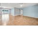 Open-concept living room with tile flooring, ceiling fan, and ample natural light at 1259 Vanderbilt Dr, Ormond Beach, FL 32174
