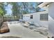 Backyard features a concrete pad, privacy fence, and simple garden beds for outdoor enjoyment at 129 S Marydell Ave, Deland, FL 32720