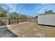 Backyard featuring a utility shed, lawn space, privacy fence and simple garden beds at 129 S Marydell Ave, Deland, FL 32720