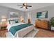 Bright bedroom featuring natural light, a neutral color scheme, and wood flooring at 129 S Marydell Ave, Deland, FL 32720