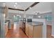 Kitchen featuring warm wood cabinets, granite countertops, and an open layout perfect for entertaining at 129 S Marydell Ave, Deland, FL 32720