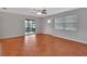Living area features terracotta tile floors, glass door to the outside and window allowing natural light at 129 S Marydell Ave, Deland, FL 32720