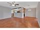 Large living area featuring terracotta tile flooring, an open layout, and ample natural light at 129 S Marydell Ave, Deland, FL 32720