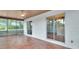Inviting screened patio featuring tile flooring, with views of the backyard at 129 S Marydell Ave, Deland, FL 32720