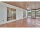 Spacious screened patio with tile flooring, offering an ideal outdoor living space at 129 S Marydell Ave, Deland, FL 32720