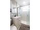 Updated bathroom featuring a single vanity and glass shower with white marble surround at 1341 Imperial Dr, Daytona Beach, FL 32117