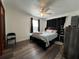 Bedroom with hardwood floors and a ceiling fan at 1341 Imperial Dr, Daytona Beach, FL 32117