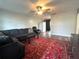 Comfortable living room with a ceiling fan and a large area rug at 1341 Imperial Dr, Daytona Beach, FL 32117