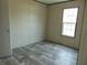 Cozy bedroom featuring a large window and modern flooring, perfect for relaxation at 1367 Vine St, Daytona Beach, FL 32117