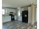 Bright kitchen with modern black appliances, white cabinets, and stylish flooring at 1367 Vine St, Daytona Beach, FL 32117
