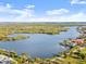 Wide aerial shot showcases a community along the water, displaying the tranquil scenery and residential landscape at 1424 Breaks Way, Port Orange, FL 32127