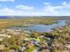 Aerial view of a home located near the water and city, surrounded by a vibrant neighborhood at 1424 Breaks Way, Port Orange, FL 32127