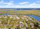 Aerial view of home showing proximity to the water and the surrounding neighborhood at 1424 Breaks Way, Port Orange, FL 32127