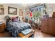 Cozy bedroom featuring decor, furniture and a sunlit window, creating a warm and inviting space at 1424 Breaks Way, Port Orange, FL 32127