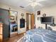 This bedroom boasts ample space, tiled flooring, and a ceiling fan for added comfort at 1424 Breaks Way, Port Orange, FL 32127