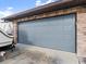 Two car garage with a gray steel door providing ample space for vehicles at 1424 Breaks Way, Port Orange, FL 32127