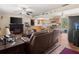 Open-concept living space with fireplace, modern television, and access to the kitchen at 1424 Breaks Way, Port Orange, FL 32127