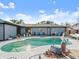 Outdoor pool area with refreshing pool, mature landscaping, and patio furniture perfect for entertaining at 1424 Breaks Way, Port Orange, FL 32127