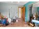 This room features fishing equipment, various items, and a glimpse into another room through an open doorway at 1424 Breaks Way, Port Orange, FL 32127