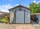 Outdoor shed with nautical-themed decorations, adding unique charm to the backyard at 1424 Breaks Way, Port Orange, FL 32127