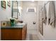 Bathroom features a vanity with a solid-surface countertop, decorative tile accents, and a shower with a curtain at 1773 Blue Oak Ct, Deland, FL 32720