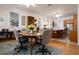 Inviting dining area with hardwood floors, ceiling fans, and natural light at 1773 Blue Oak Ct, Deland, FL 32720