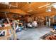 Large garage space offering ample storage, a workbench area and overhead lighting at 1773 Blue Oak Ct, Deland, FL 32720