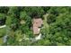 Aerial view showcases the home’s location within a lush, tree-filled environment at 1875 Glenwood Oaks Ln, Deland, FL 32720