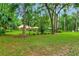 Lush backyard features mature trees and ample green space, providing privacy at 1875 Glenwood Oaks Ln, Deland, FL 32720