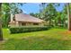 Expansive backyard featuring lush lawn and mature trees offer a peaceful setting at 1875 Glenwood Oaks Ln, Deland, FL 32720