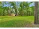 Spacious backyard boasts a large grassy area, perfect for outdoor activities at 1875 Glenwood Oaks Ln, Deland, FL 32720