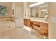Bathroom featuring a vanity with a makeup area, tub, and tiled floors at 1875 Glenwood Oaks Ln, Deland, FL 32720