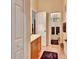 Clean bathroom with a glass-enclosed shower and neutral colored tile floors at 1875 Glenwood Oaks Ln, Deland, FL 32720